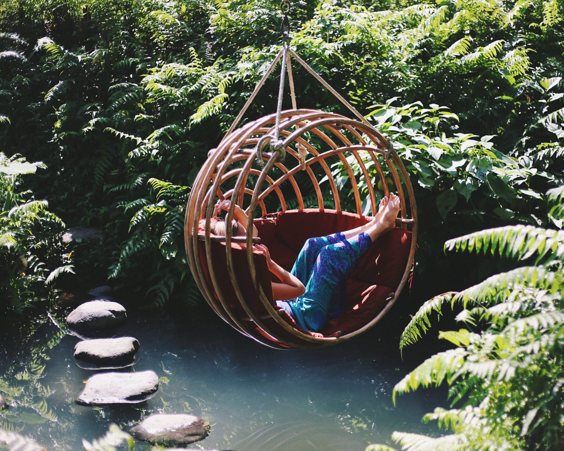 person on the hanging chair
