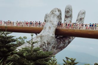 people walking on bridge during daytime