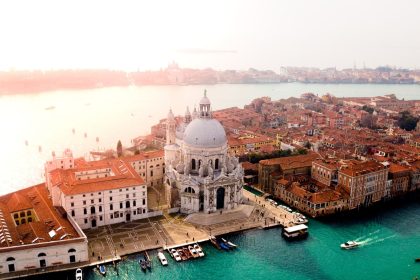 aerial photo of concrete buildings near calm water