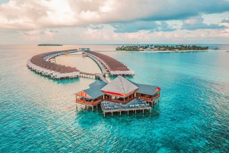 aerial photography of resort rooms and island
