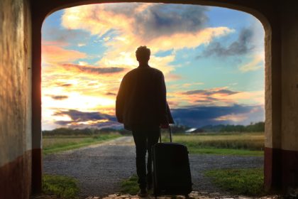 man holding luggage photo