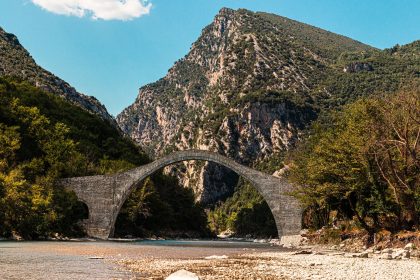 gray concrete bridge over the river