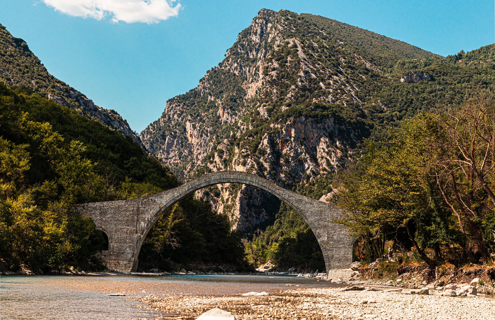 gray concrete bridge over the river