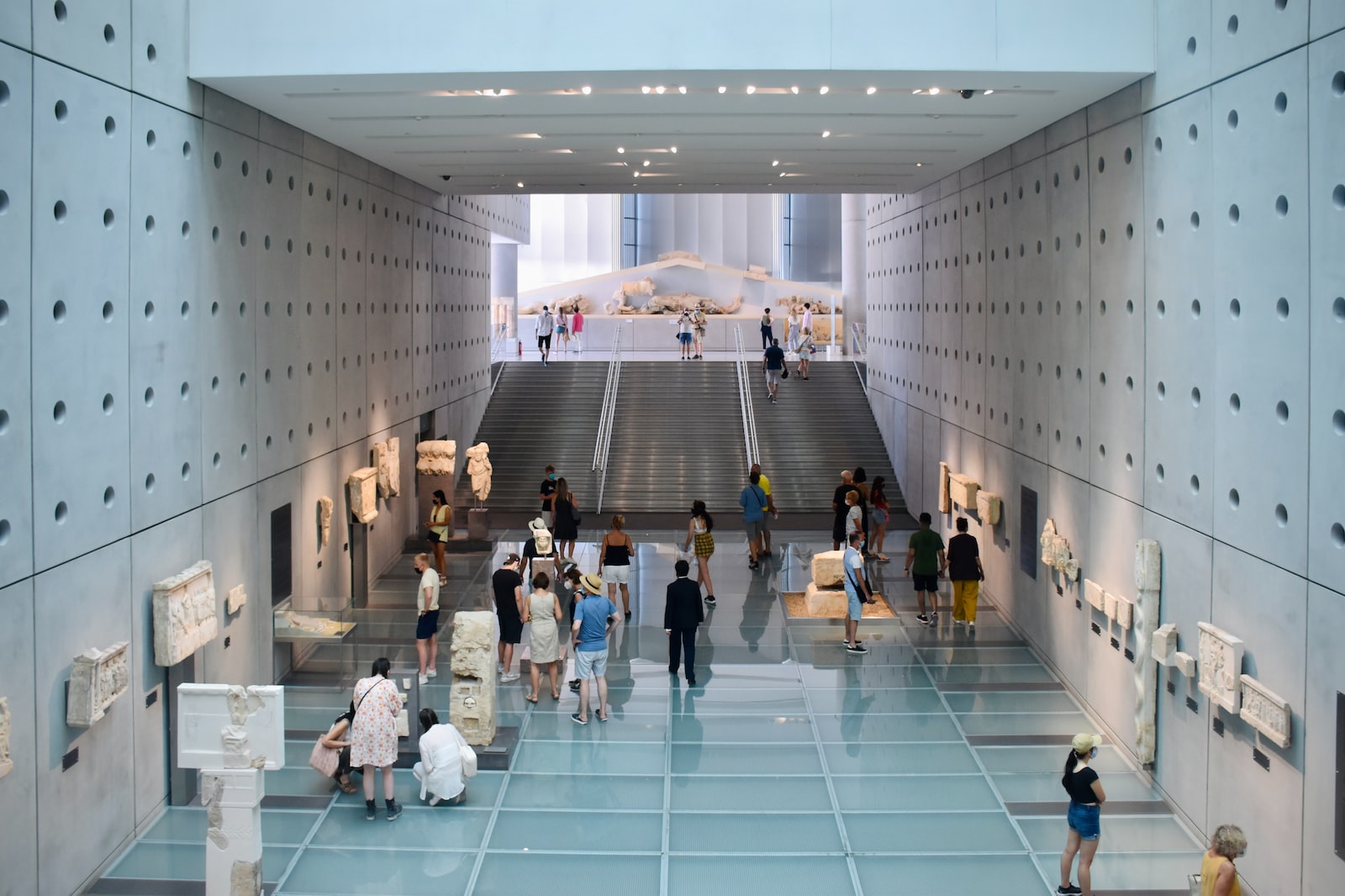 people walking on white tiled floor