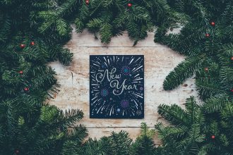 green Christmas decor with New Year greetings