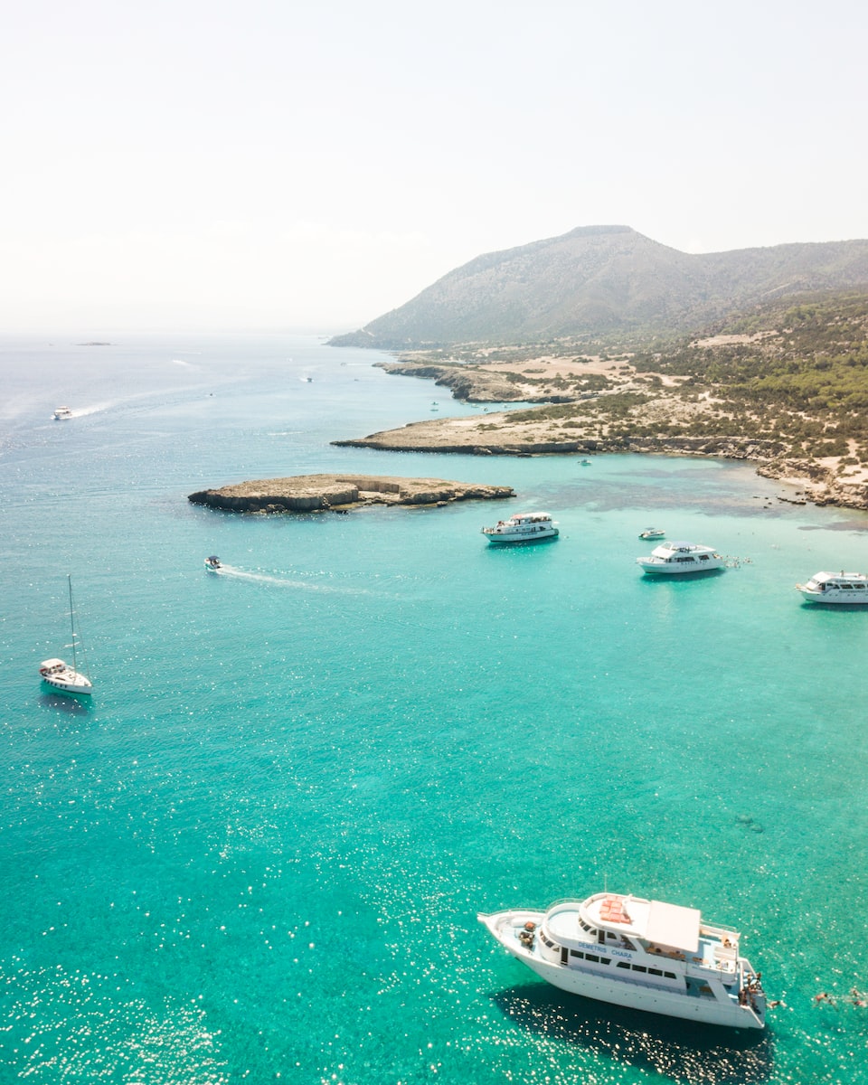 yachts on body of water at daytime