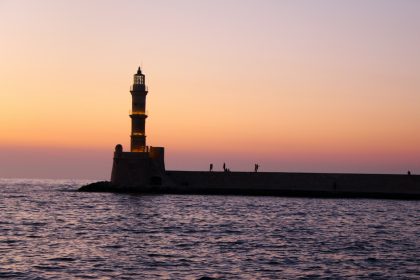 silhouette of lighthouse during sunset
