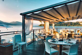 a restaurant with a view of the water