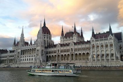 white and brown concrete cathedral building nearby sea