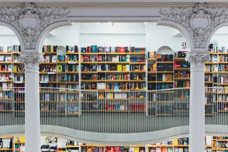 books on white wooden shelf