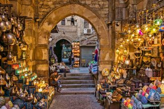 a narrow alley way with a lot of items on display