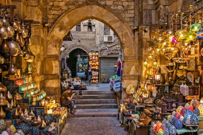 a narrow alley way with a lot of items on display