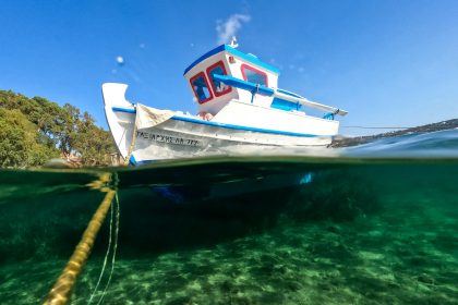 a boat in the water with a rope in the foreground