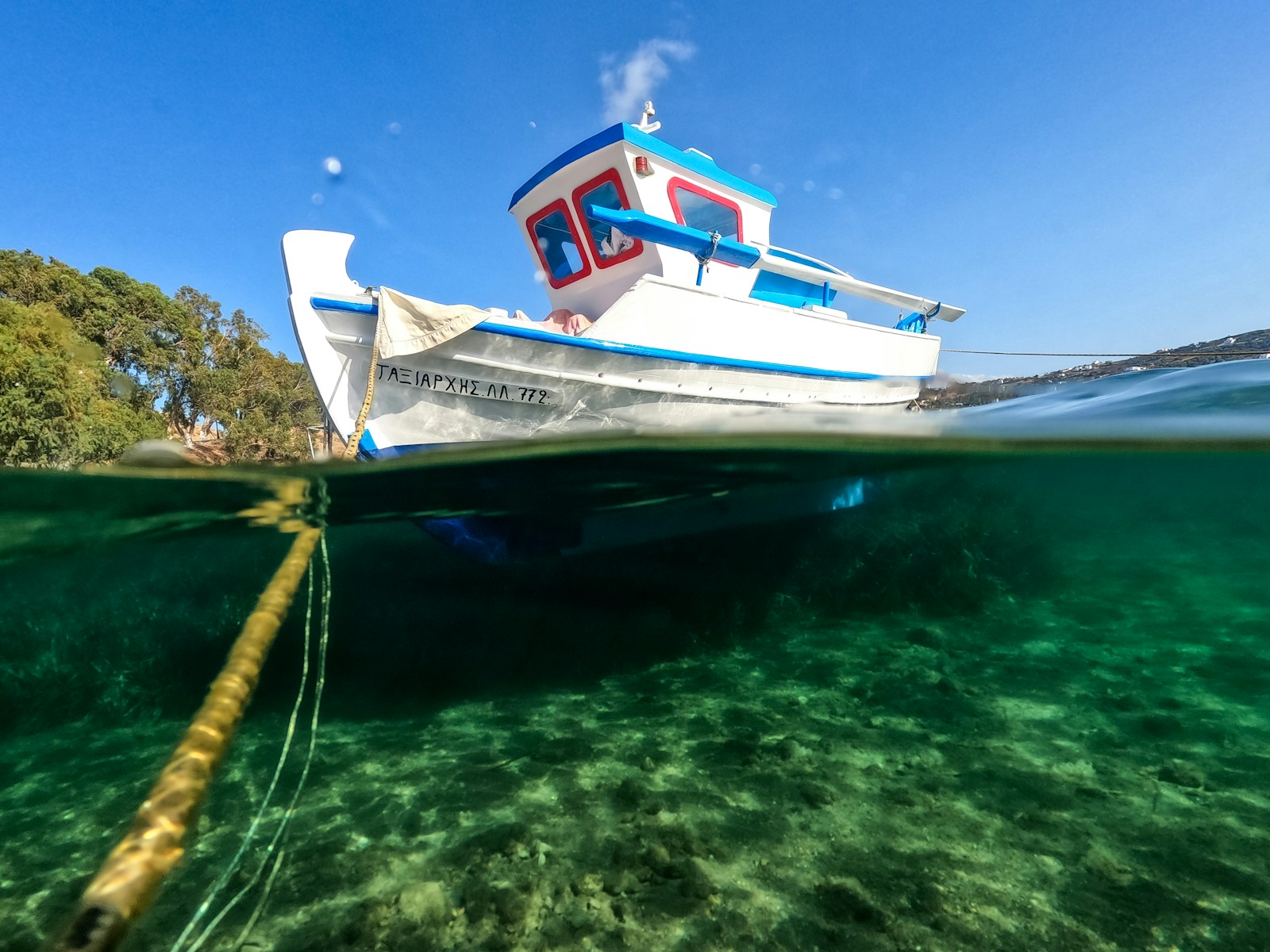 a boat in the water with a rope in the foreground