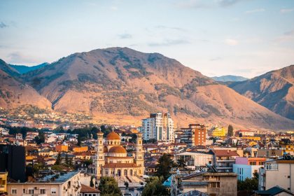 a city with mountains in the background