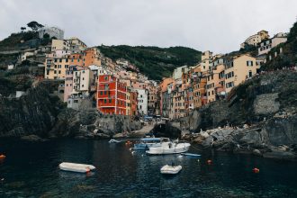 A group of boats floating on top of a body of water
