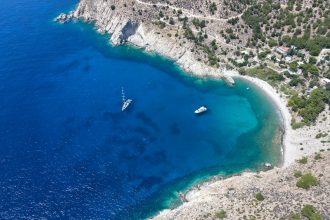an aerial view of a boat in the water