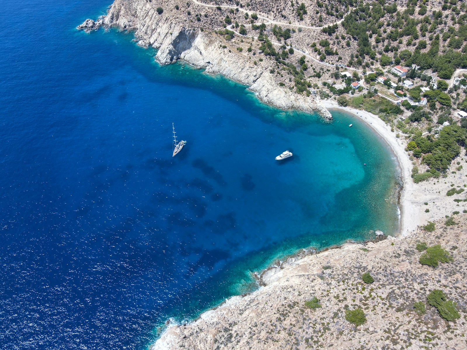 an aerial view of a boat in the water