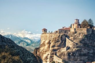 a castle perched on top of a rocky cliff